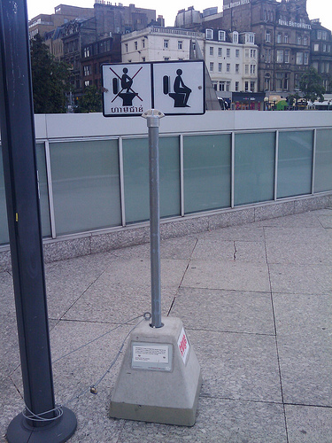 sign showing proper toilet usage