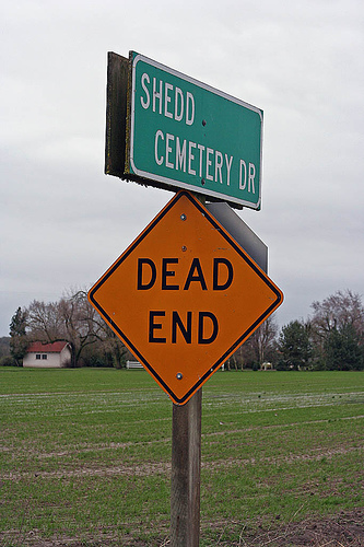 Sign of cemetery drive and dead end